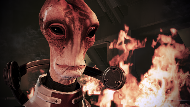 Mordin Solus the Salarian stands before an explosion in Mass Effect 3